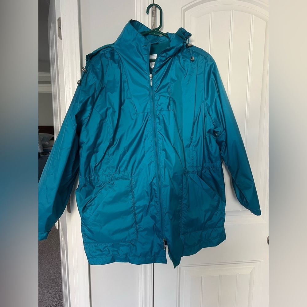RainCoat or Cold weather coat with hood. 100% Nylon. Size large.